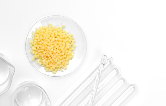 Candelilla Wax SP-75. Chemical ingredient for Cosmetics & Toiletries product on white laboratory table.