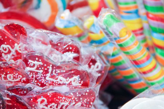 Many colorful candies in store color bright background lollipop