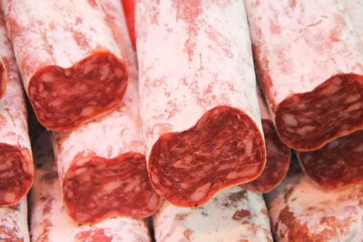 Close up of traditional cut Spanish dried pork sausage Salchichon