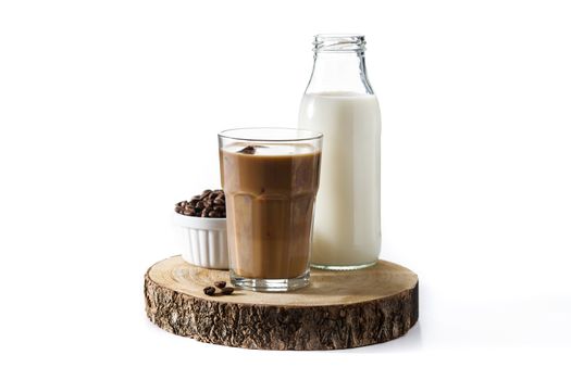 Iced coffee or caffe latte in tall glass on wooden table