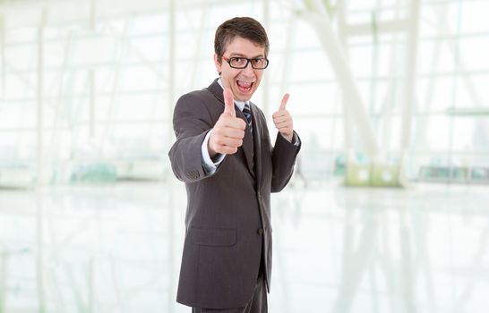 young business man going thumbs up, at the office