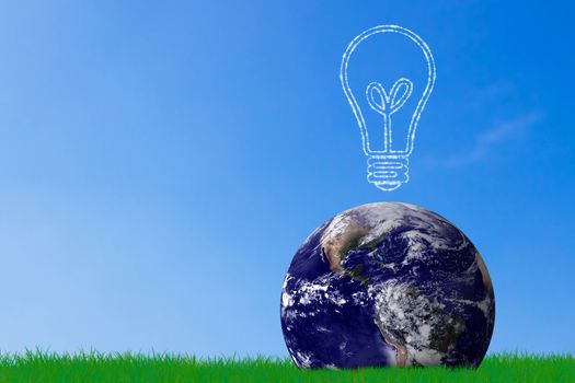 Green energy concept, the earth and light bulb on grass background, nature and ecology, Elements of this image furnished by NASA