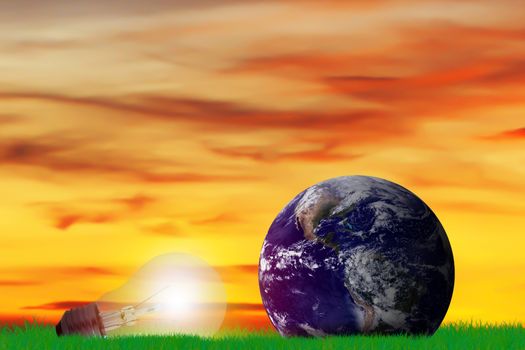 Green energy concept, the earth and light bulb on grass background, nature and ecology, Elements of this image furnished by NASA