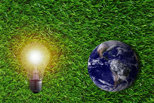 Green energy concept, the earth and light bulb on grass background, nature and ecology, Elements of this image furnished by NASA