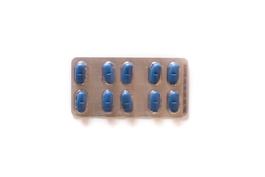 Blue medical pills isolated on white background