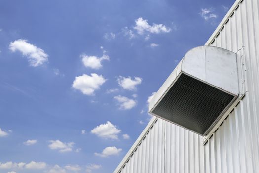 The ventilation duct of the building is on the side of the building.