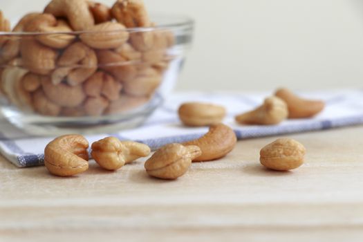 Cashew nuts in a cup and placed on the table.