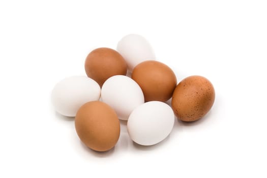 Brown and white eggs isolated on white background