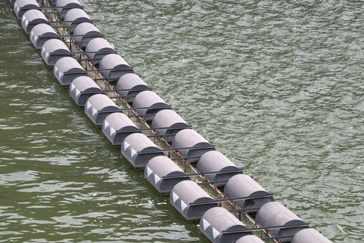 Buoys for blocking debris around the dam. Buoys that float on the surface.