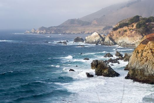 Coastal view of Big Sur landscape and scenery, with pacific ocean and rocks on the coastline during sunset.California, USA. Travel and tourism