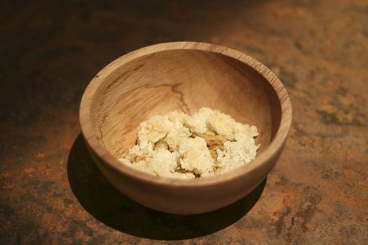 Food is in a bowl made of wood. Food containers for prisoners in prisons in the past.