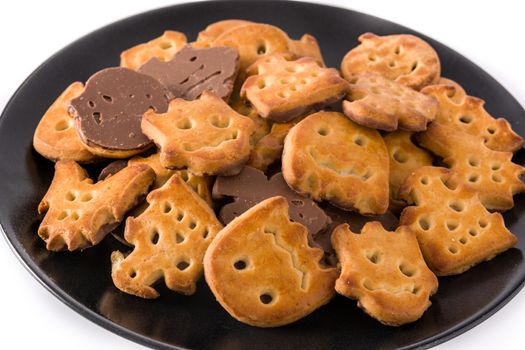 Halloween cookies on black plate isolated on white background