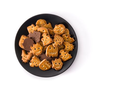 Halloween cookies on black plate isolated on white background