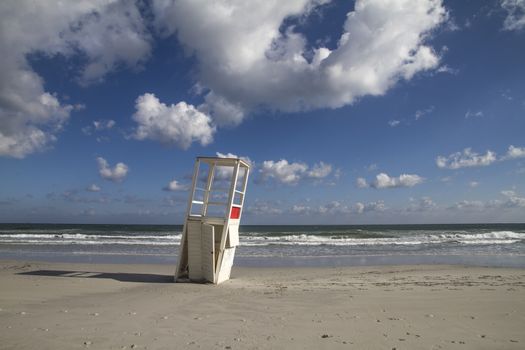 Watchtower in the winter sea. After a whole season of work helping the man in his surveillance task, he rests on his side, abandoned to the bad weather of the sea.