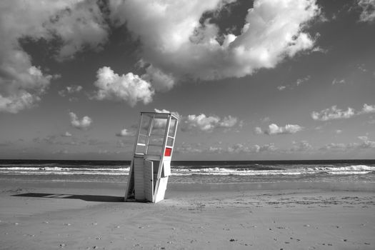 Watchtower in the winter sea. After a whole season of work helping the man in his surveillance task, he rests on his side, abandoned to the bad weather of the sea.