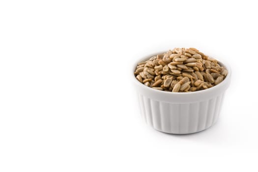 Sunflower seeds in bowl isolated on white background