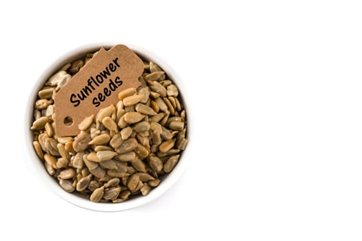 Sunflower seeds in bowl isolated on white background