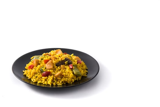 Fried rice with chicken and vegetables on black plate isolated on white background