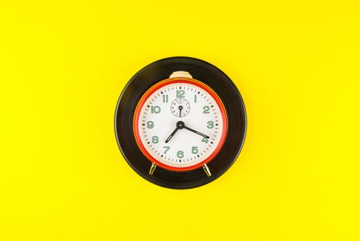 Red alarm clock isolated on yellow background, Time concept, Rush hour concept, Copy space image for your text, Flat lay
