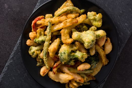 Japanese vegetable tempura on black background