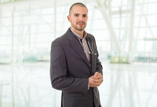 happy male doctor, at the hospital