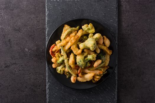 Japanese vegetable tempura on black background