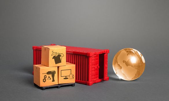 Orange globe, cardboard boxes and red freight ship container. International world trade. Deliver goods, shipping. Import export traffic. Delivery goods under closed borders, quarantine restrictions.