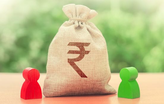 Indian rupee money bag and a deal between two persons. Business lending, leasing. Tender competitiona contract. Trade agreement. Negotiation process dealings. Dispute solution. Finance surety promise