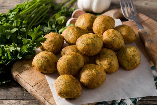 Cod fritters on wooden table