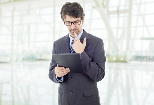 young businessman working with a tablet pc, at the office