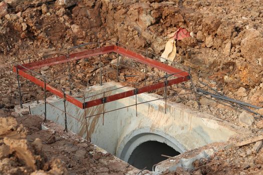 Steel frame for casting manhole covers. Public drainage pipe laying work.