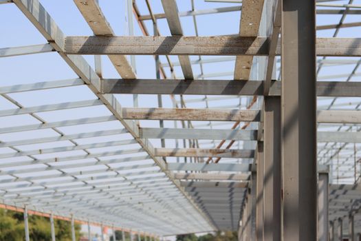 Steel structure for roof installation. Gray iron structure of construction site