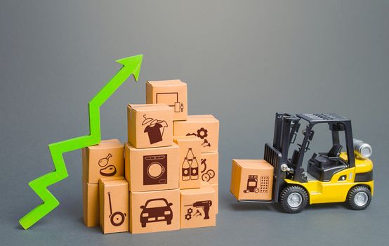 Forklift next to boxes and green up arrow. Logistics, transport infrastructure. Growth of online distribution of goods, increased delivery. E-commerce. High demand and sales. Economic recovery.