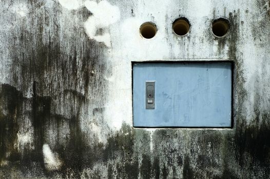 Electric Box on Old Grunge Concrete Wall.