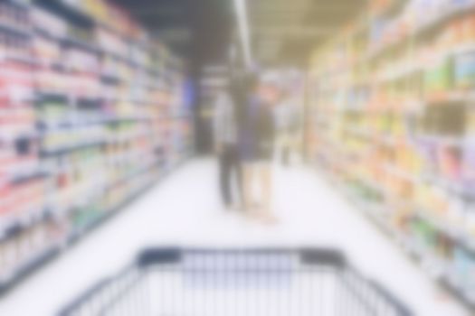 Blurred Shopping Cart in Supermarket.