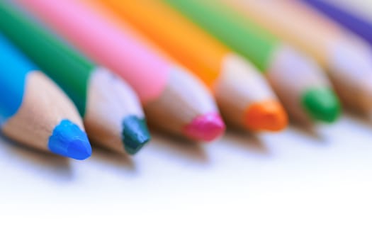 Colorful pencils in a row. Close-up