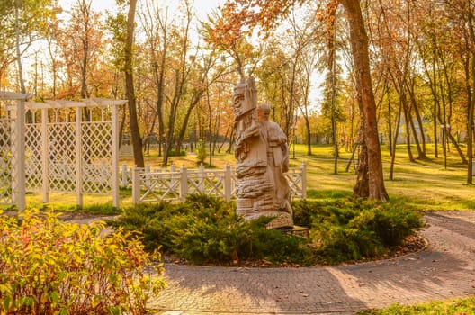 carved wooden sculpture in the autumn park