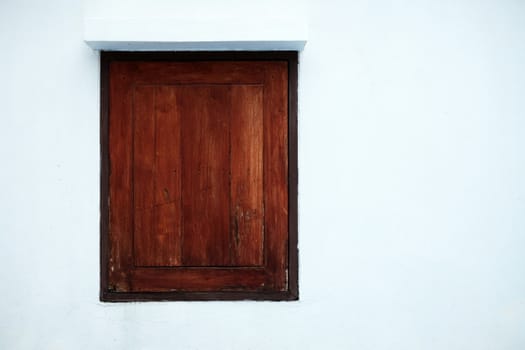 Old Wood Window on White Concrete Wall Background.