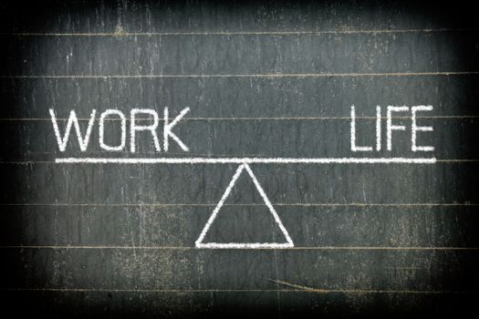 Balance of Work and Life Concept on Chalkboard Background.