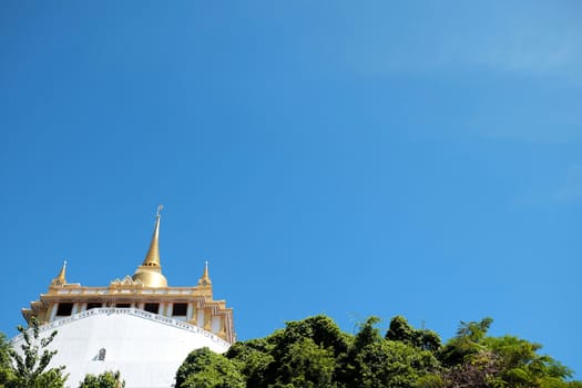 Temple of the Golden Mount on Blue Sky Background, Landmark of Bangkok Thailand.