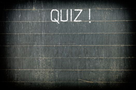 "QUIZ !" Chalk Writing on Old Chalkboard Background.