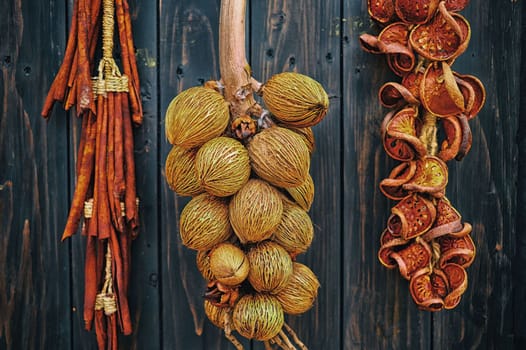 Young Dried Coconut hanging on Wooden Wall.