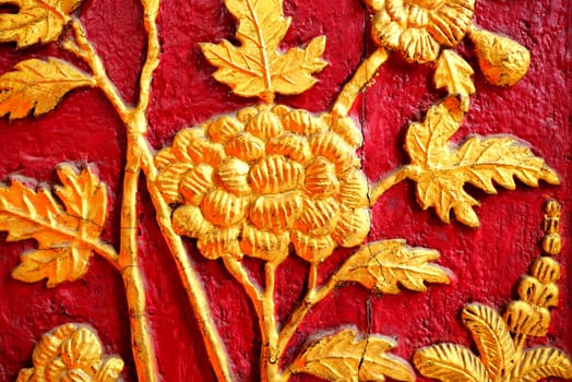 Vintage Thai Sculpture of Golden Flower on Wall.