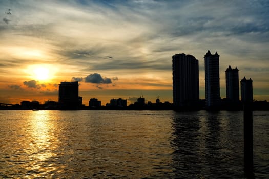 Scenery of Sunset at Chaophraya River at Asiatique Market Pier. Chaophraya River is the major river in Bangkok, Thailand.