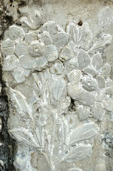 Vintage Thai Sculpture on Stone Wall.