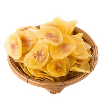 Dried banana chips in wooden bowl. Yellow deep fried slices of bananas Isolated on white background.