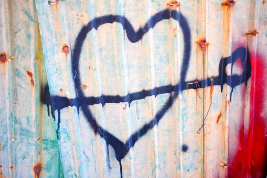 Spray Painted Heart Sing on Old Zinc Wall.