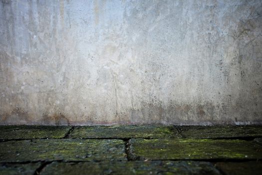 Grunge Concrete Wall Background with Pavement.
