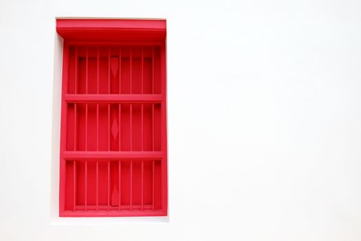 Red Wooden Window with White Painting Concrete Wall.