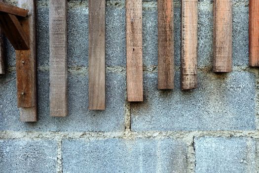 Pieces of Wood on Concrete Wall Background.